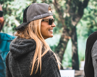ADF military female wearing a dark gray hoodie & snap back unisex hat wearing Gatorz Delta sunglasses